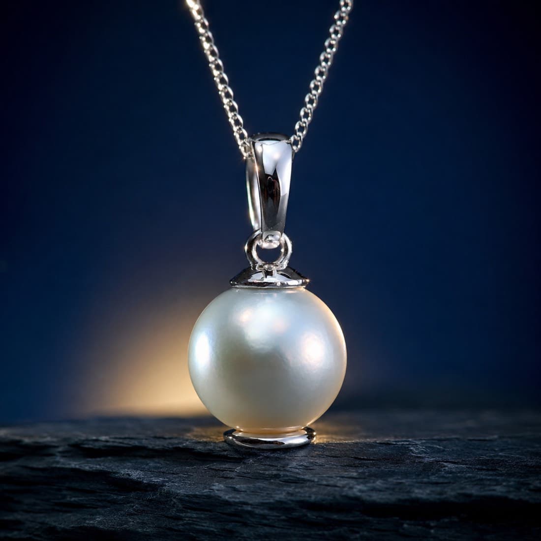 Cultured Pearl Pendant 9 mm — A single 9 mm cultured pearl on a silver cup and peg.