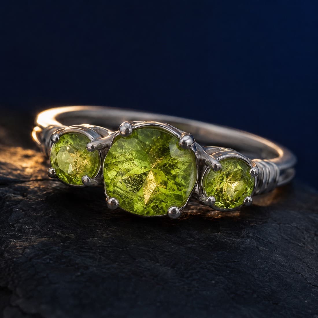Peridot Trilogy Ring — Three graduated peridots in a row. 1.85 ct total carat weight.